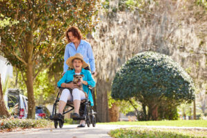 Caregiver taking a client for a walk