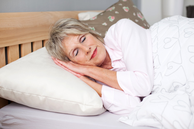 Senior woman sleeping in bed | Seniors and Sleep Health | BLOG POST | Comfort Keepers Victoria